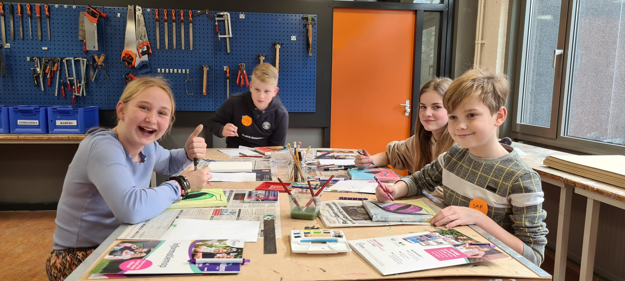 Lachende gezichten tijdens de doe-middag van het Altena College